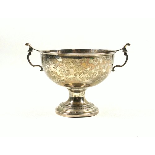 493 - George V silver pedestal bowl, with 2 lyre shaped handles, the stepped circular foot with foliate de... 