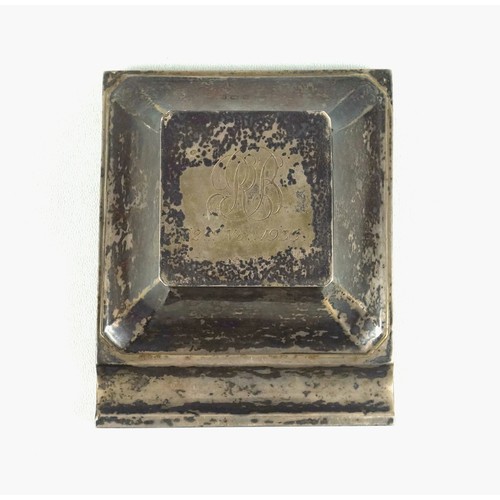 510 - George V silver presentation ink stand, of square tapering form with canted corners, with a pen rest... 