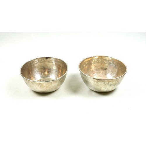 512 - Pair of Eastern white metal bowls, each set with a 1780 Maria Theresa Thaler, Dia.11.3cm, 338grs. (2... 