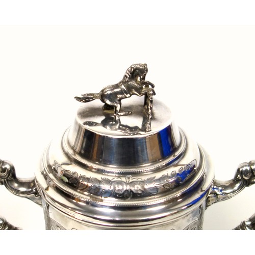 520 - Early 20th Century silver plated Britannia metal show jumping trophy cup with chased and embossed fl... 