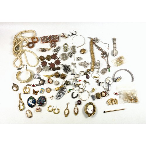 526 - A quantity of costume jewellery to include pearl necklaces, brooches, watches, earrings and military... 