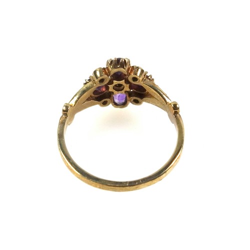 532 - Edwardian style 9ct gold ring with 4 amethysts and 5 seed pearls in a floral openwork setting by Reg... 