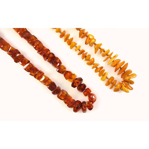 535 - An amber necklace, length 57.5cm, 46.3 grams; a butterscotch amber necklace (clasp detached), length... 