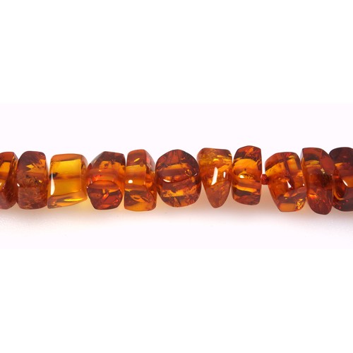 535 - An amber necklace, length 57.5cm, 46.3 grams; a butterscotch amber necklace (clasp detached), length... 