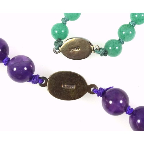 537 - An amethyst necklace with a white metal clasp stamped silver, length 67cm, the beads are graduated f... 