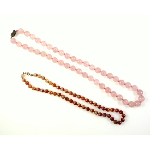 538 - A rose quartz necklace with a gilt white metal clasp stamped silver, length 62.5cm, the beads are 1.... 