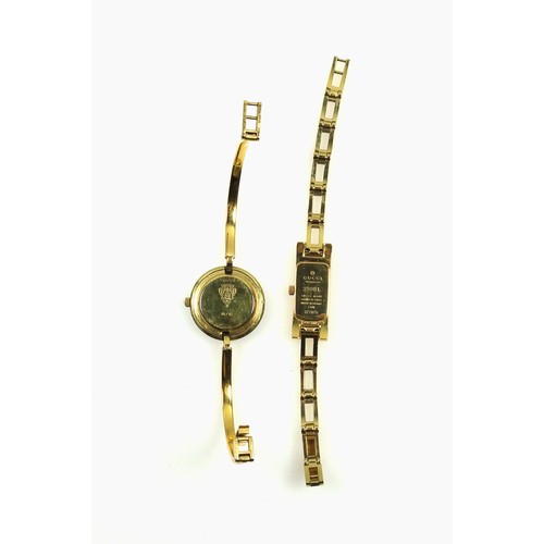 543 - A Lady's Gucci gilt metal watch, the rectangular guilloché dial with two baton hour markers, integra... 