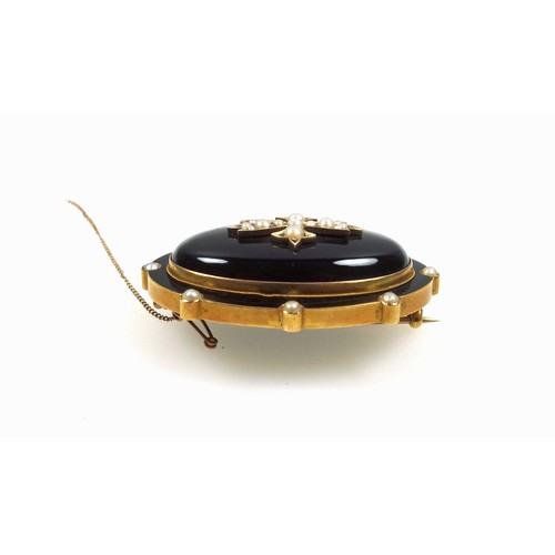 545 - Victorian gilt metal and black onyx mourning brooch, of oval form, the outer rim set seed pearls, en... 