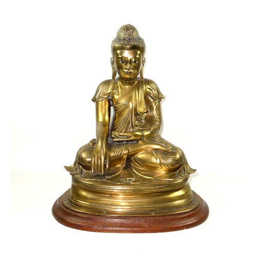 682 - Large Burmese gilt bronze figure of Buddha, Mandalay Period, 19th Century, wearing a pleated Sanghat... 