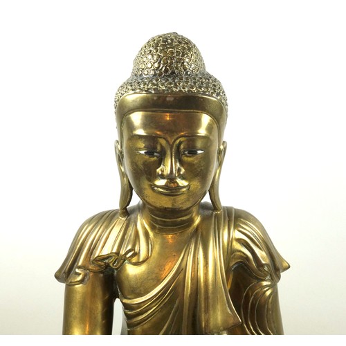 682 - Large Burmese gilt bronze figure of Buddha, Mandalay Period, 19th Century, wearing a pleated Sanghat... 