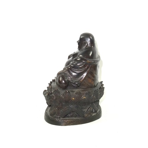 684 - 19th Century Chinese bronze figure of Budai finely hollow-cast with a laughing expression, seated in... 