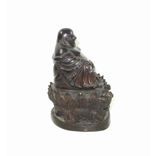 684 - 19th Century Chinese bronze figure of Budai finely hollow-cast with a laughing expression, seated in... 