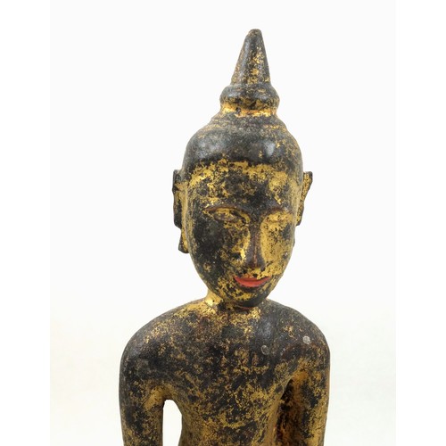 702 - 18th Century Thai or Laos carved giltwood figure of Buddha, seated in Ardha Padmasana, his right han... 