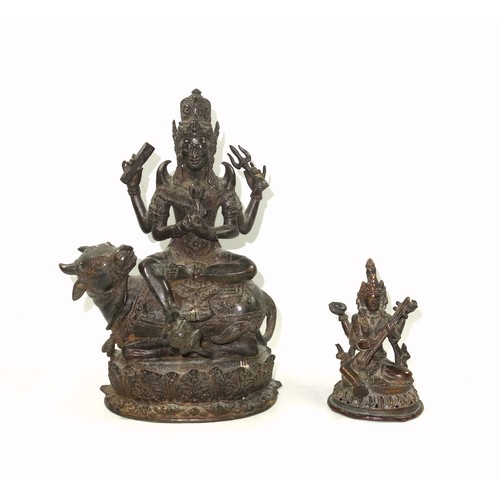 703 - 19th Century Indian bronze figure of Umiya, seated in Lalitasana with her right foot on a lotus flow... 