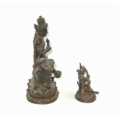 703 - 19th Century Indian bronze figure of Umiya, seated in Lalitasana with her right foot on a lotus flow... 