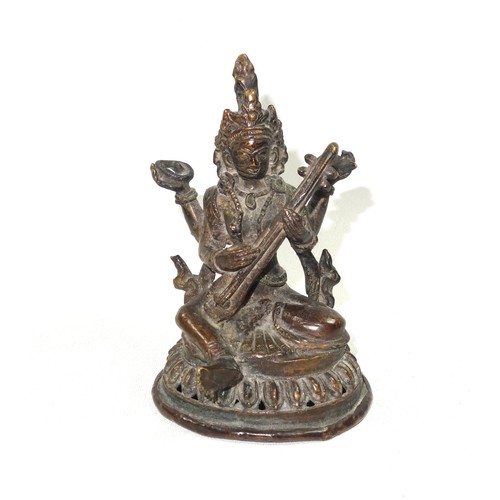 703 - 19th Century Indian bronze figure of Umiya, seated in Lalitasana with her right foot on a lotus flow... 