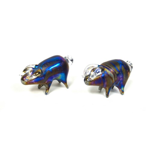 850 - Lazlo glass, two iridescent hand blown art glass pig paperweights, signed to underside, each 13cm lo... 