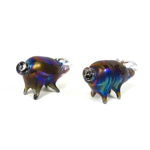 850 - Lazlo glass, two iridescent hand blown art glass pig paperweights, signed to underside, each 13cm lo... 