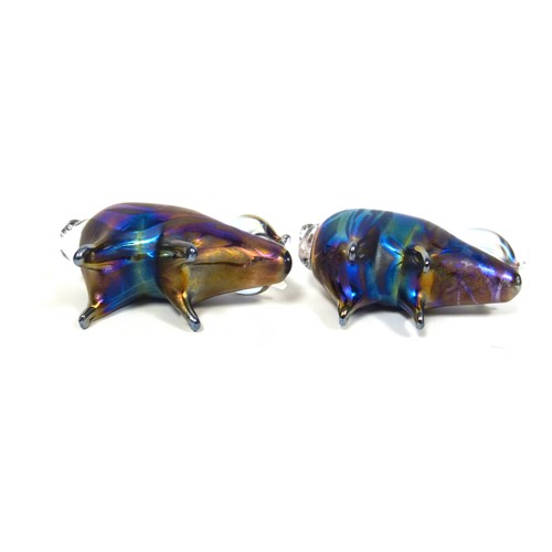 850 - Lazlo glass, two iridescent hand blown art glass pig paperweights, signed to underside, each 13cm lo... 