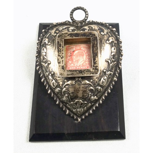 523 - Edwardian silver embossed heart shaped hinged paper clip with inset hinged stamp case on a rectangul... 