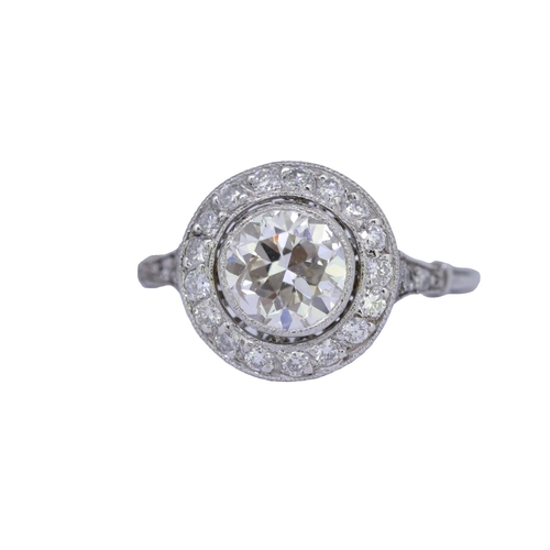 22 - DIAMOND CLUSTER RING, set with a central diamond of approx. 1.32 ct. surrounded by diamonds and diam... 