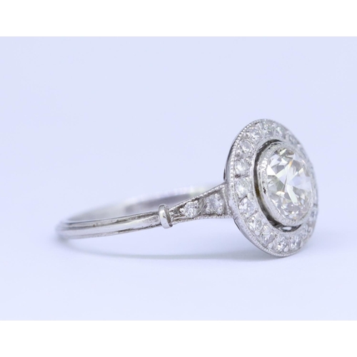 22 - DIAMOND CLUSTER RING, set with a central diamond of approx. 1.32 ct. surrounded by diamonds and diam... 