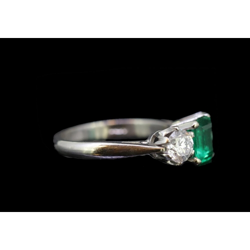 30 - 1.33 ct. COLOMBIAN EMERALD AND DIAMOND RING, set with a square cut Colombian emerald of 1.33 ct. bet... 