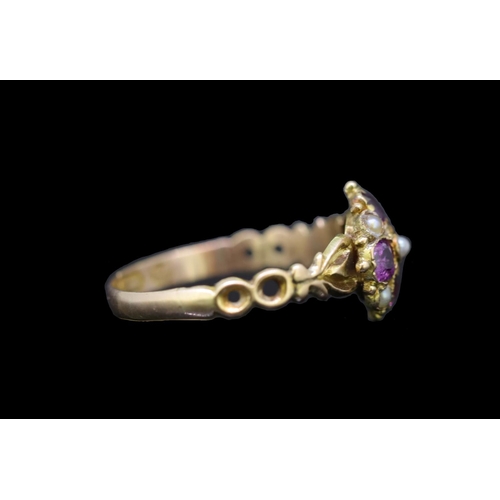 41 - ANTIQUE GARNET AND PEARL RING, set with 4 garnets and 5 seedpearls. Part openwork shank. Size O. 1.6... 