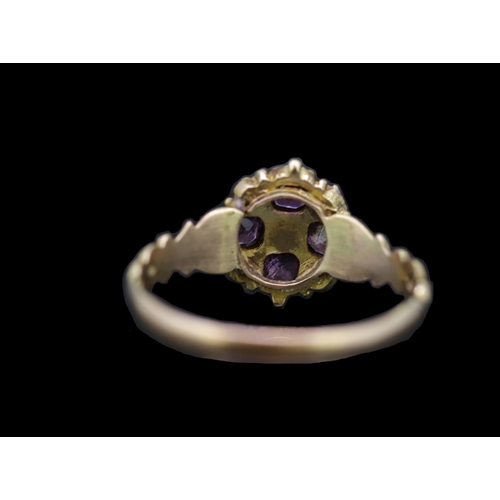 41 - ANTIQUE GARNET AND PEARL RING, set with 4 garnets and 5 seedpearls. Part openwork shank. Size O. 1.6... 