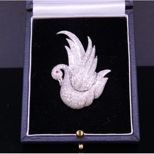 43 - DIAMOND AND RUBY SWAN BROOCH, set throughout with diamonds totalling approx. 4.25 ct. and a ruby acc... 