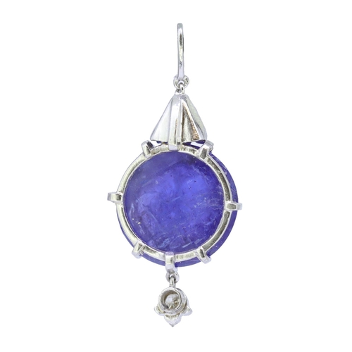 54 - TANZANITE AND DAIMOND PENDANT, set wiht a central cabochon cut tanzanite of approx. 16.15 ct. with a... 