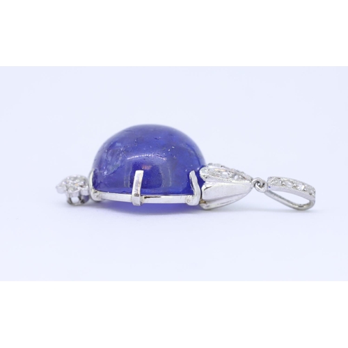 54 - TANZANITE AND DAIMOND PENDANT, set wiht a central cabochon cut tanzanite of approx. 16.15 ct. with a... 