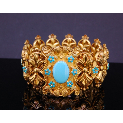 24 - ANTIQUE TURQOISE LINK BRACELET, the links of scrolling design, alternated with a floral shaped turqu... 
