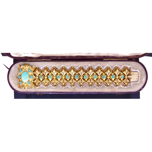24 - ANTIQUE TURQOISE LINK BRACELET, the links of scrolling design, alternated with a floral shaped turqu... 