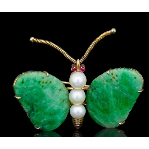 25 - JADE, PEARL AND RUBY BUTTERFLY BROOCH, the wings eash set with a carved green jade. the body set wit... 