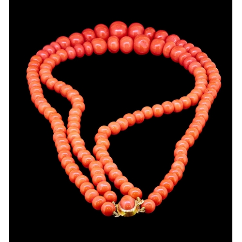 27 - 2-ROW CORAL NECKLACE, set with graduated beads ranging from approx. 6.85 - 14.1 mm. L. 40.5 cm. 80.3... 