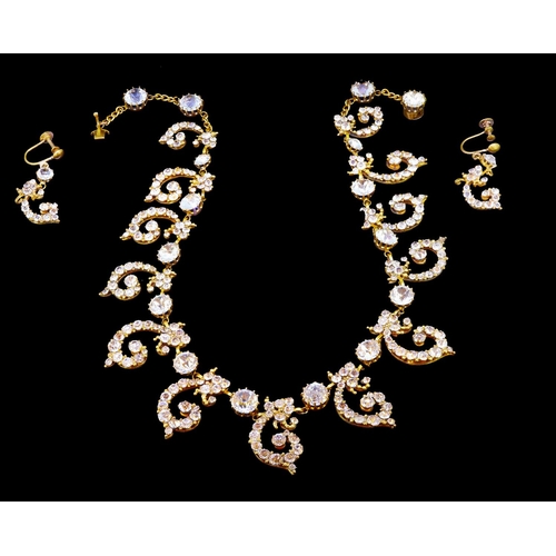 28 - ANTIQUE PASTE NECKLACE AND EARRINGS SET, the necklace designed with 13 scrolling drops, alternated w... 