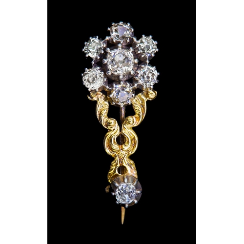 36 - ANTIQUE VICTORIAN DIAMOND FLORAL BROOCH, of part openwork scrolling design. Set to the top with a di... 