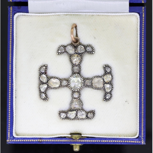 46 - AN ANTIQUE DIAMOND CROSS PENDANT, 19TH CENTURY in yellow gold and silver, set with a central rose cu... 