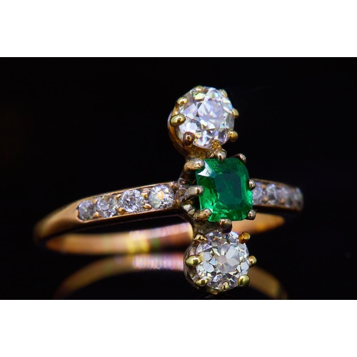 48 - EMERALD AND DIAMOND DRESS RING, set with a central emerald of approx. 0.26 ct. flanked with diamonds... 