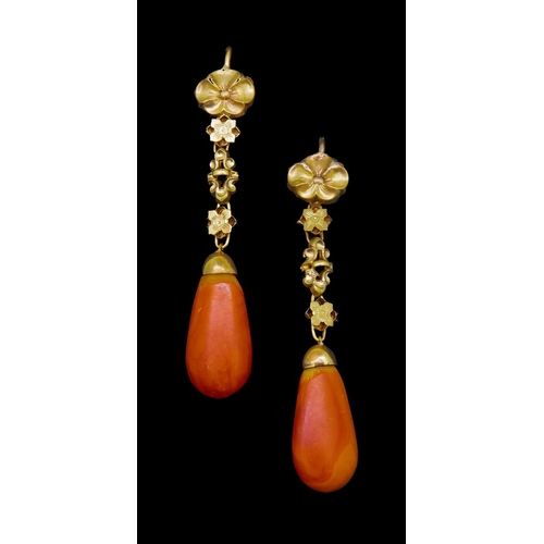 55 - PAIR OF AMBER DROP EARRINGS, the top of floral relief design, suspending floral relief links ending ... 