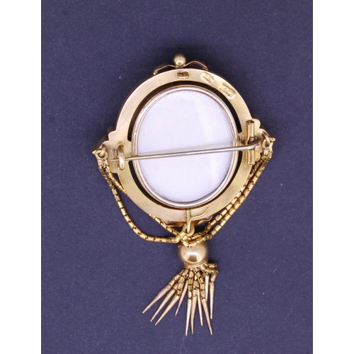 100 - ANTIQUE OVAL BROOCH WITH FRINGED TASSEL DROP, set in the centre with seed pearls in a star pattern, ... 