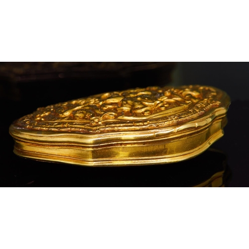 148 - 18TH CENTURY 18-ct GOLD SNUFFBOX, of triangular design. The cover decorated in relief with a scene o... 