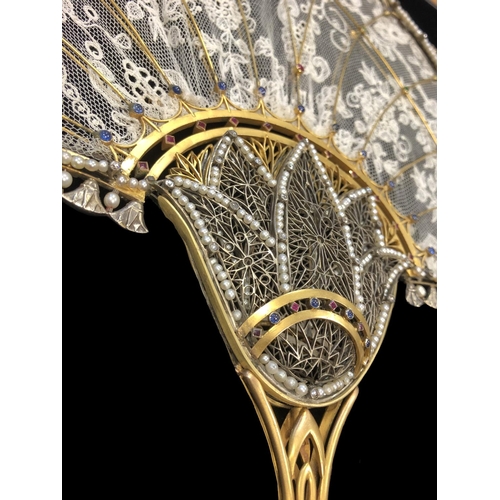 234 - IMPORTANT GEM SET HAND FAN, 18 ct yellow gold frame, the handle of openwork floral design, sprouting... 