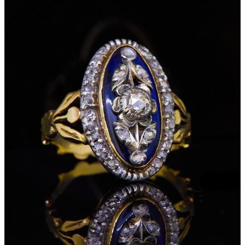 275 - ANTIQUE DIAMOND AND BLUE GLASS DIAMOND DRESS RING. Set with a central floral diamond applique on a b... 