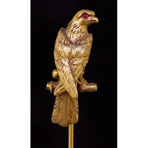 293 - ANTIQUE VICTORIAN GARNET SET EAGLE TIE PIN, shaped in relief as an eagle sitting on a stick, the eye... 