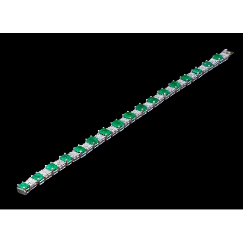 328 - EMERALD AND DIAMOND BRACELET, alternatedly set with an emerald and diamonds. Emeralds totalling appr... 