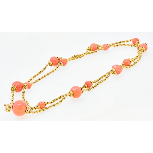 335 - CORAL LINK NECKLACE, the necklace of twisted rope design, set with 13 graduated coral beads, and a l... 