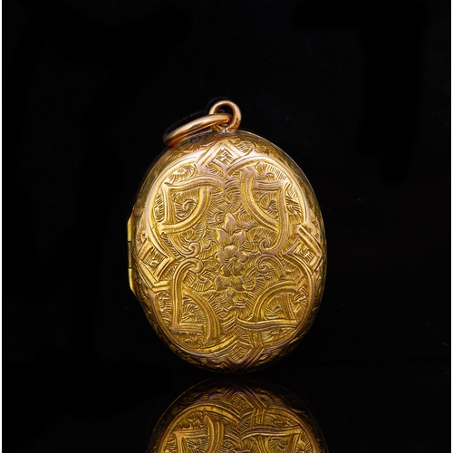 71 - ANTIQUE VICTORIAN LOCKET PENDANT, of oval design, decorated to the front and back with floral engrav... 