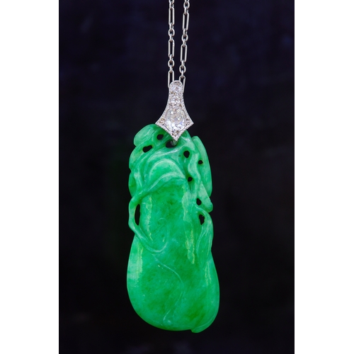 300 - CARVED JADE PENDANT, in the shape of a gourd. With a diamond set bail totalling approx. 0.30 ct. Wit... 